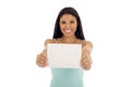 Young attractive and happy hispanic woman holding blank card with copy space Royalty Free Stock Photo