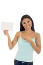 Young attractive and happy hispanic woman holding blank card with copy space Royalty Free Stock Photo