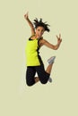 Young attractive and happy Latin sport woman jumping excited and cheerful in gym exercise workout healthy lifestyle and freedom co Royalty Free Stock Photo
