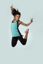 Young attractive and happy Latin sport woman jumping excited and cheerful in gym exercise workout healthy lifestyle Royalty Free Stock Photo