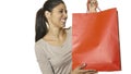 Young attractive and happy latin woman holding red shopping bag smiling cheerful and positive isolated on white background in sale Royalty Free Stock Photo