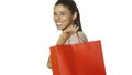 Young attractive and happy latin woman holding red shopping bag smiling cheerful and positive isolated on white background in sale Royalty Free Stock Photo