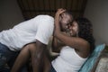 Young attractive and happy romantic African American couple in love lying playful cuddling at living room couch playing together Royalty Free Stock Photo