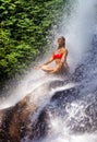 Young attractive and happy 30s woman with fit body practicing yoga wet under tropical paradise waterfall stream in meditation and Royalty Free Stock Photo