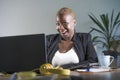 Young attractive and happy successful black afro american woman in business jacket working cheerful at office laptop computer desk Royalty Free Stock Photo