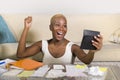 Young attractive and happy successful black afro American woman smiling satisfied domestic accounting business tax and payments in Royalty Free Stock Photo