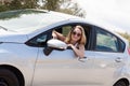 Young attractive happy woman sitting in car summertime Royalty Free Stock Photo