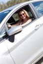 Young attractive happy woman sitting in car summertime Royalty Free Stock Photo