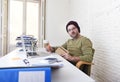 Young attractive hipster businessman working from his home office as freelancer self employed business model Royalty Free Stock Photo