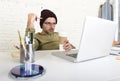 Young attractive hipster businessman working from his home office as freelancer self employed business model Royalty Free Stock Photo