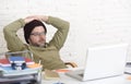 Young attractive hipster businessman working from his home office as freelancer self employed business model Royalty Free Stock Photo