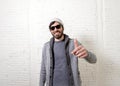 Young attractive hipster and trendy style looking man posing coo Royalty Free Stock Photo