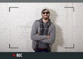 Young attractive hipster and trendy style man in selfie and internet video blogger recording Royalty Free Stock Photo