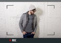 Young attractive hipster and trendy style man in selfie and internet video blogger recording Royalty Free Stock Photo