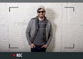 Young attractive hipster and trendy style man in selfie and internet video blogger recording Royalty Free Stock Photo