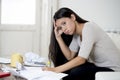 Young attractive latin woman at home living room couch calculating monthly expenses worried in stress Royalty Free Stock Photo