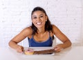 Portrait of young happy woman eating delighted chocolate bar and donuts Royalty Free Stock Photo