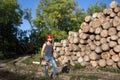 Lumberjack with chainsaw and ax in forest