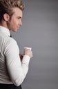 Young attractive macho drinking coffe