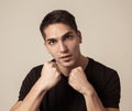 Young attractive man with an angry face in boxing stance ready to fight