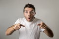 Young attractive man astonished amazed in shock surprise face expression and shock emotion Royalty Free Stock Photo