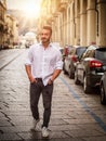 Young man in European city street walking Royalty Free Stock Photo