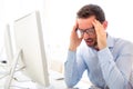 Young attractive man got a headache at the office Royalty Free Stock Photo