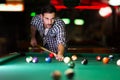 Young attractive man playing pool in bar Royalty Free Stock Photo