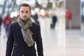 Young attractive man transiting a railway station