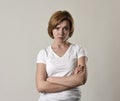 Young attractive and moody woman posing alone angry and upset in bad mood and rage face Royalty Free Stock Photo