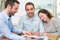 Young attractive people signing cotract with meeting real estate