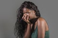 Young attractive sad and depressed black African American woman feeling bad and desperate crying stressed suffering anxiety crisis Royalty Free Stock Photo