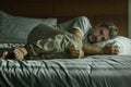 Young attractive sad and depressed man crying helpless on bed at home bedroom feeling overwhelmed and desperate suffering Royalty Free Stock Photo
