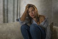 Young attractive sad and depressed woman at home feeling worried and scared during covid-19 virus outbreak in home quarantine