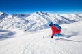 Young attractive skier skiing in famous ski resort in Alps, Livigno, Italy, Europe Royalty Free Stock Photo