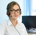 Young Attractive Smiling Customer Support Phone Operator with Headset in Office. Royalty Free Stock Photo