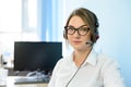 Young Attractive Smiling Customer Support Phone Operator with Headset in Office. Royalty Free Stock Photo