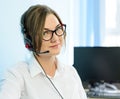 Young Attractive Smiling Customer Support Phone Operator with Headset in Office. Royalty Free Stock Photo