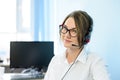 Young Attractive Smiling Customer Support Phone Operator with Headset in Office. Royalty Free Stock Photo