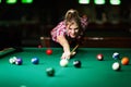 Young attractive woman playing pool in bar Royalty Free Stock Photo