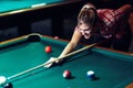 Young attractive woman playing pool in bar Royalty Free Stock Photo