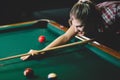 Young attractive woman playing pool in bar Royalty Free Stock Photo