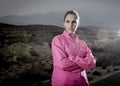 Young attractive sport woman in running jacket posing with attitude defiant cool