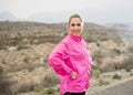 Young attractive sport woman in running jacket posing with attitude defiant cool Royalty Free Stock Photo