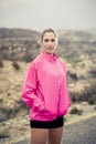 Young attractive sport woman in running jacket posing with attitude defiant cool Royalty Free Stock Photo