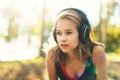 Young attractive sportswoman listening to music wearing headphones. Sport, fitness, workout