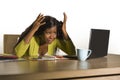 Young attractive stressed and overworked black African American woman working upset and desperate at office computer desk feeling Royalty Free Stock Photo