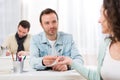 Young attractive student lend a pen to classmate