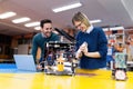 Young attractive students of mechatronics working on project Royalty Free Stock Photo