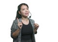 Young attractive and successful Asian Japanese woman in microphone headset coaching and training business strategies talking in Royalty Free Stock Photo